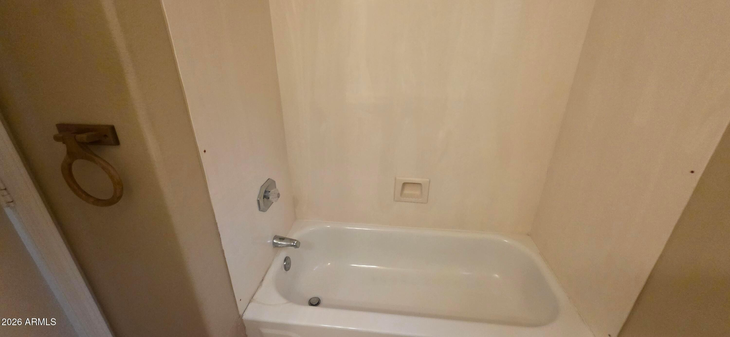 9163 West Davis Road Peoria, AZ 85382 - Photo 15 of 24 a close view of a bathtub in a bathroom