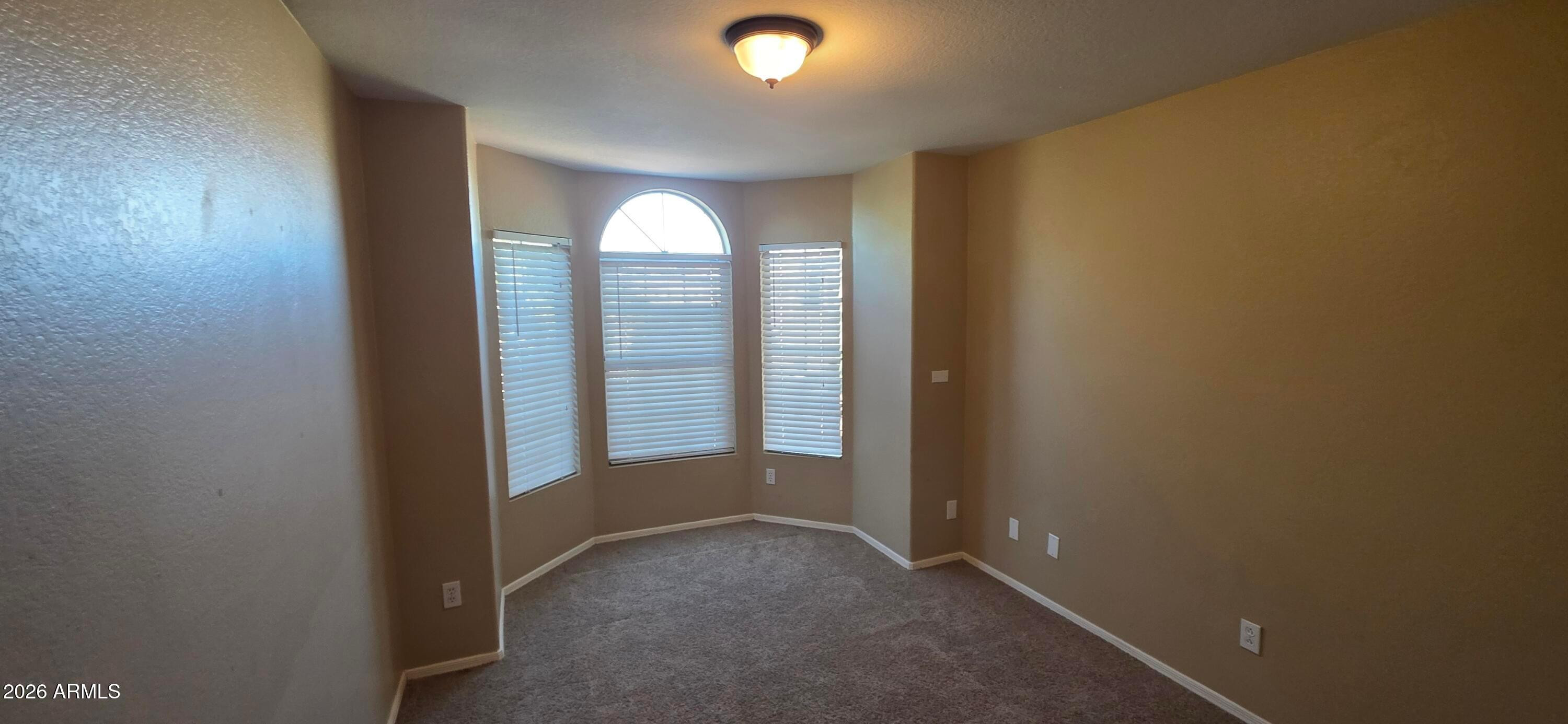 9163 West Davis Road Peoria, AZ 85382 - Photo 19 of 24 an empty room with windows