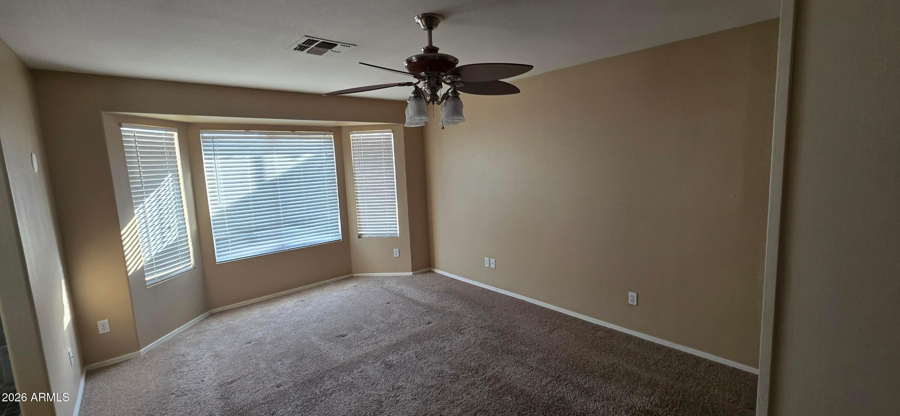9163 West Davis Road Peoria, AZ 85382 - Photo 21 of 24 a view of empty room with windows