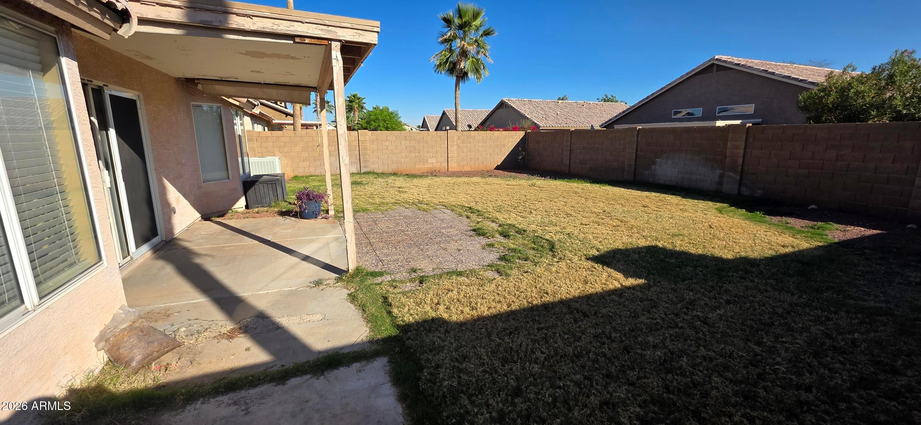 9163 West Davis Road Peoria, AZ 85382 - Photo 22 of 24 a front view of a house with a yard