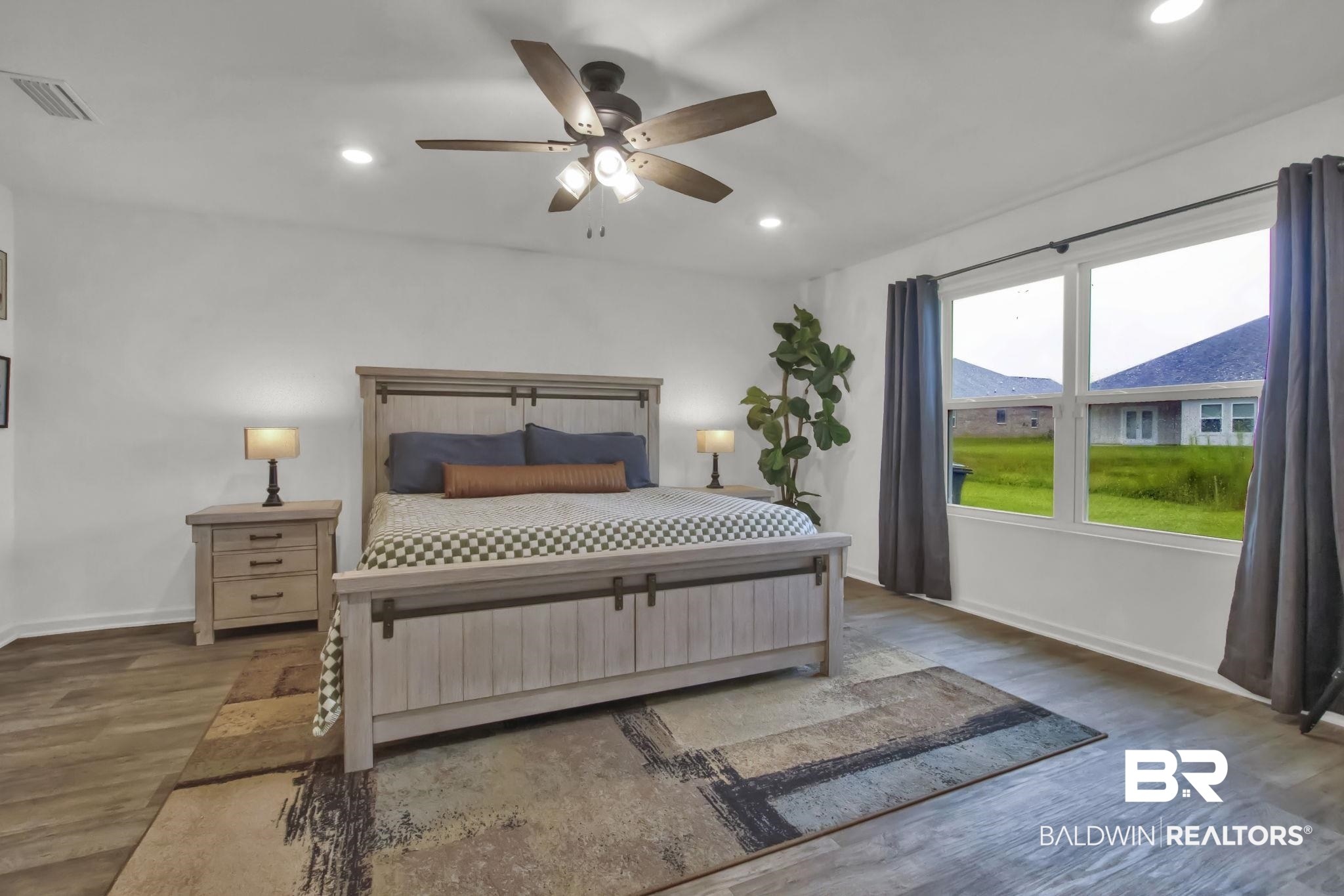 23810 Unbridled Loop Daphne, AL 36526 - Photo 17 of 50 Bedroom with ceiling fan and dark hardwood / wood-style flooring