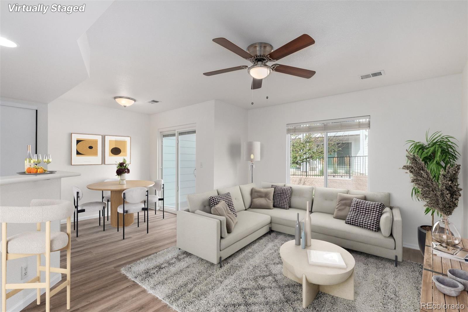 5850 Ceylon Street, Unit D Denver, CO 80249 - Photo 1 of 33 a living room with furniture and a window