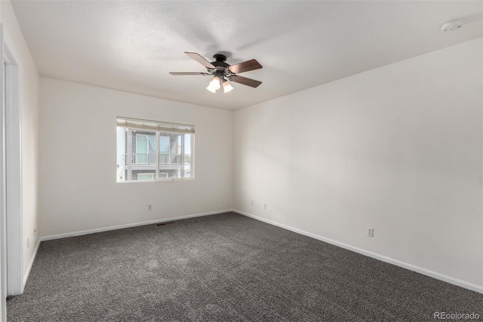 5850 Ceylon Street, Unit D Denver, CO 80249 - Photo 14 of 33 a view of an empty room with a window