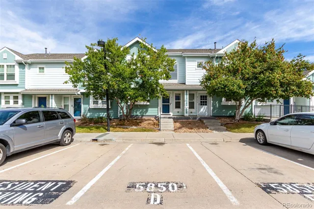 a view of a car park in front of a building
