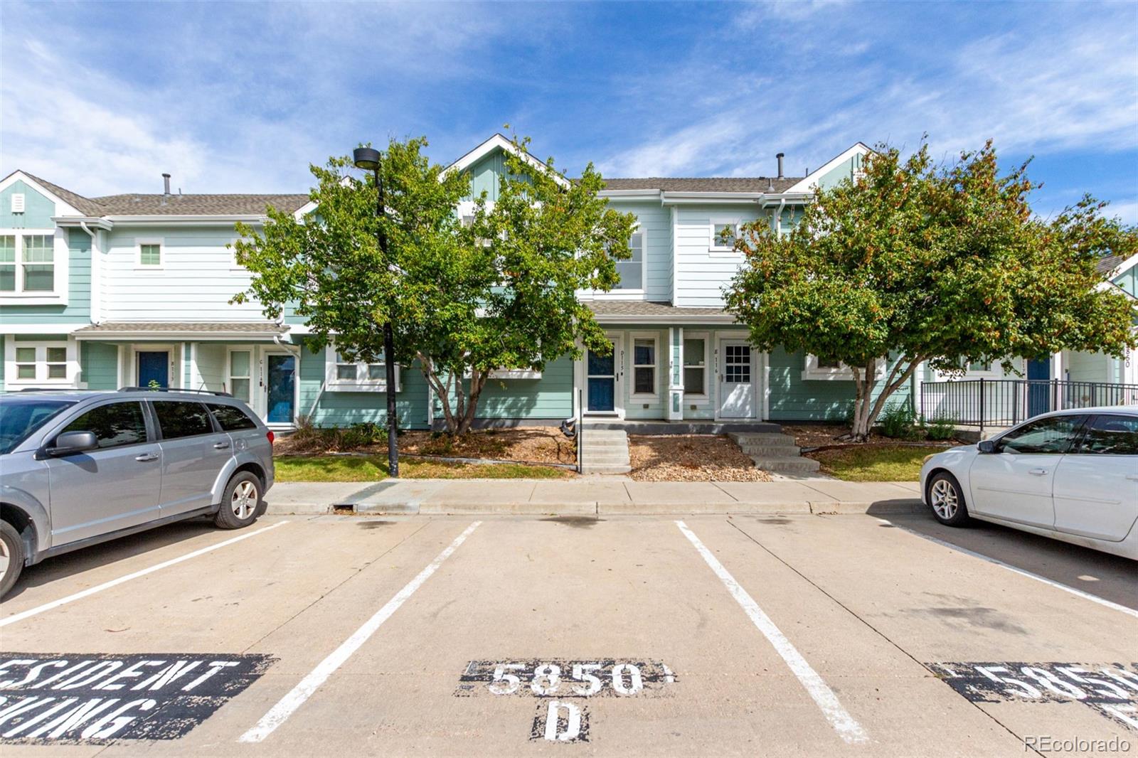 5850 Ceylon Street, Unit D Denver, CO 80249 - Photo 2 of 33 a view of a car park in front of a building
