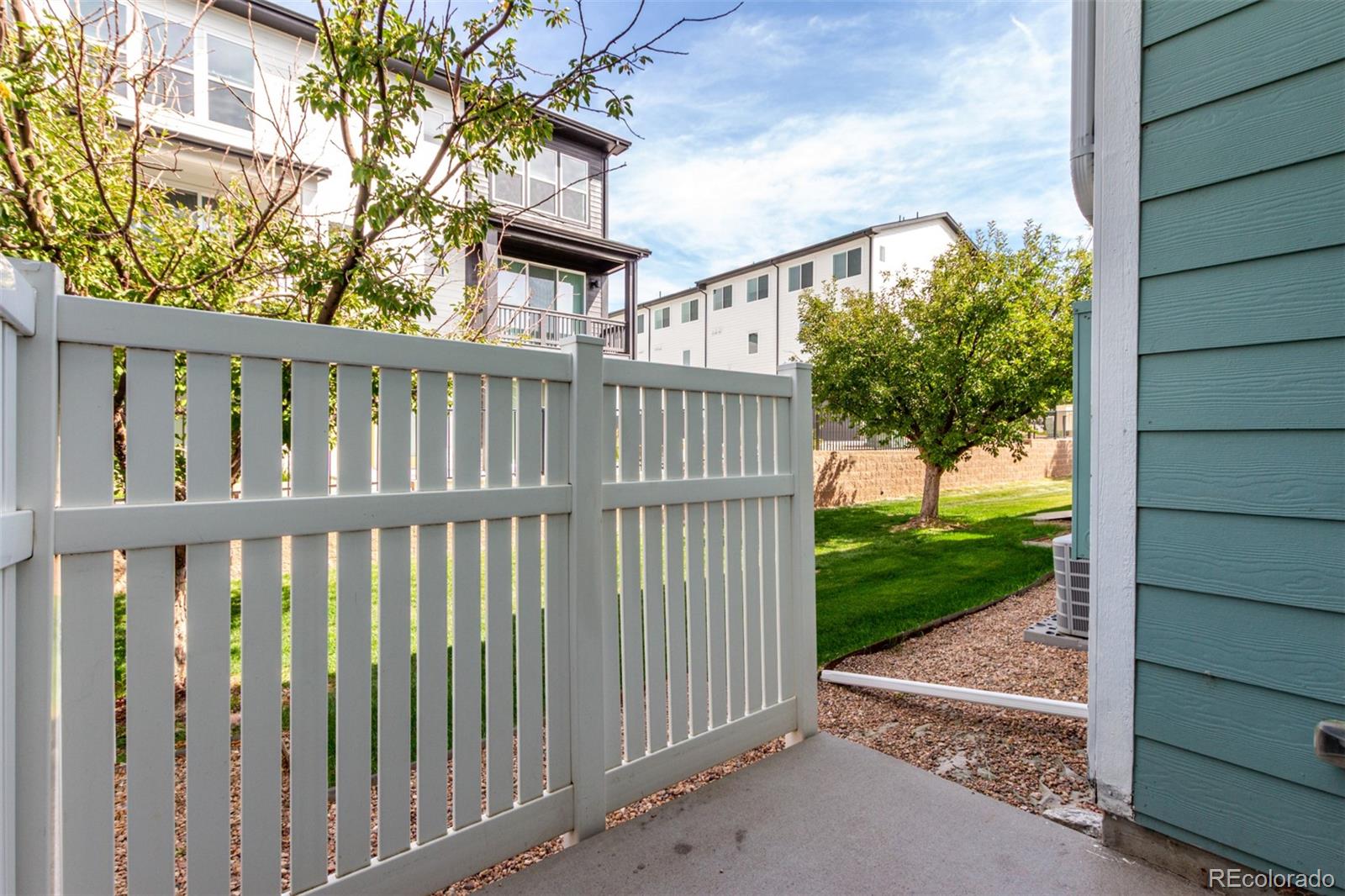 5850 Ceylon Street, Unit D Denver, CO 80249 - Photo 25 of 33 a view of a porch with a yard