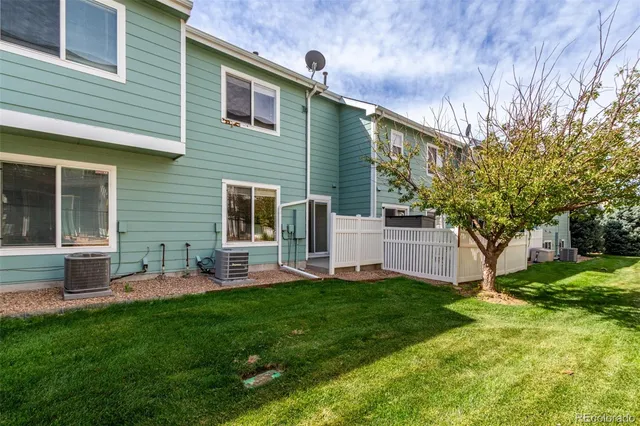 a front view of the house with yard and green space