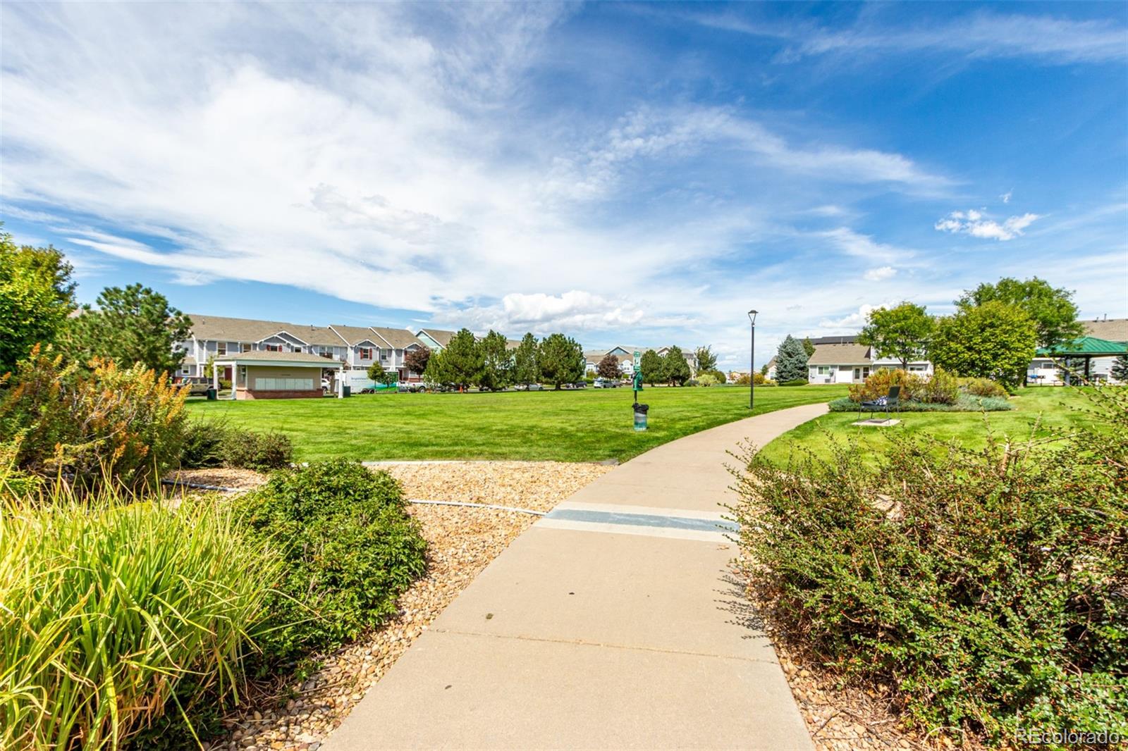 5850 Ceylon Street, Unit D Denver, CO 80249 - Photo 30 of 33 a view of a garden with lawn chairs