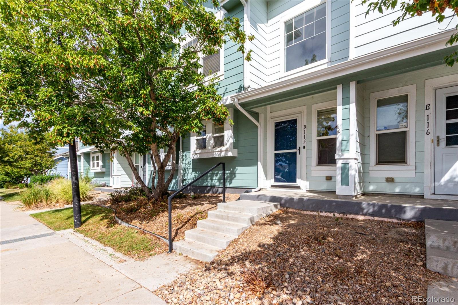 5850 Ceylon Street, Unit D Denver, CO 80249 - Photo 3 of 33 a front view of a house with a tree