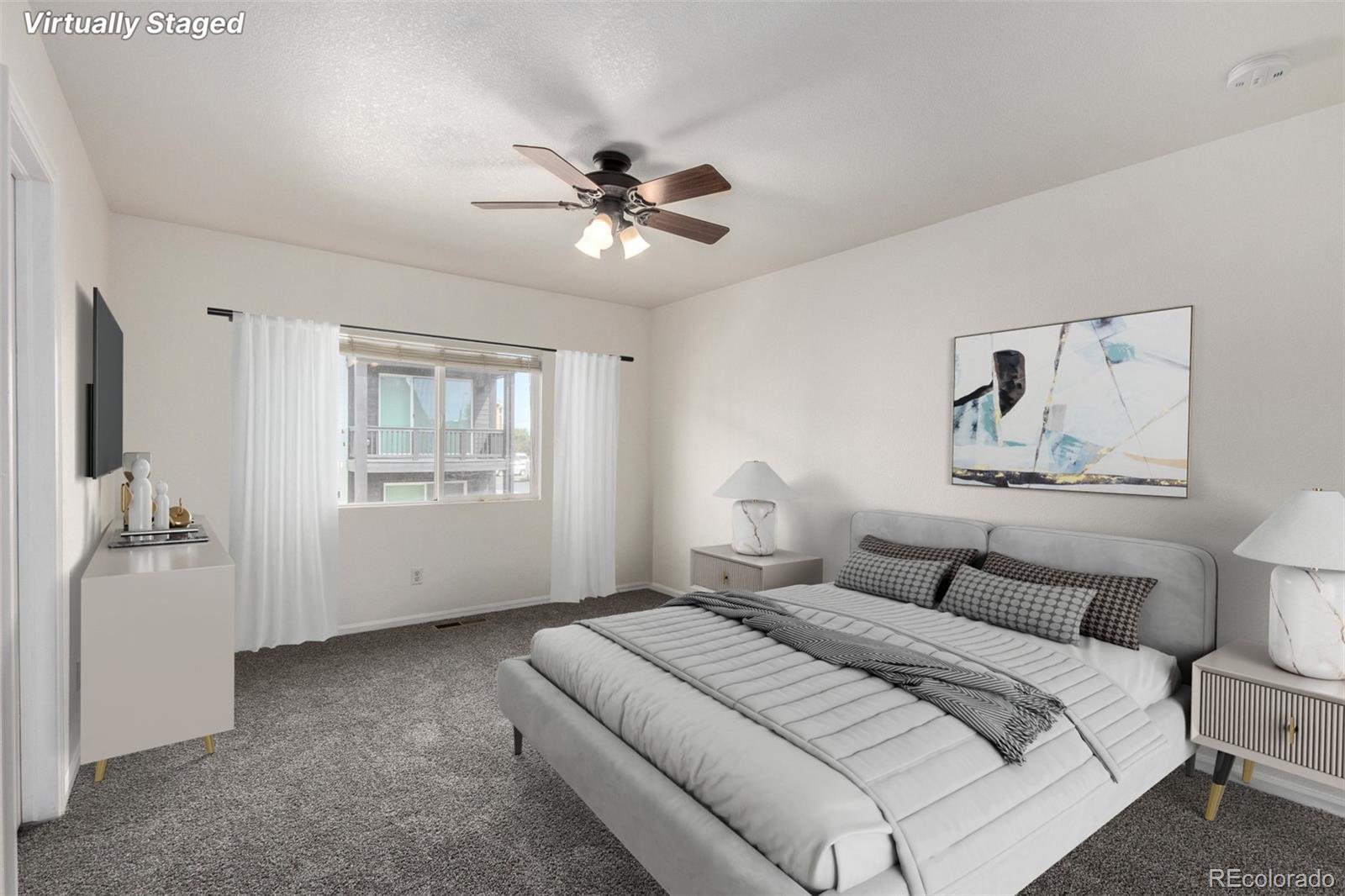 5850 Ceylon Street, Unit D Denver, CO 80249 - Photo 4 of 33 a bedroom with a white bed and a window