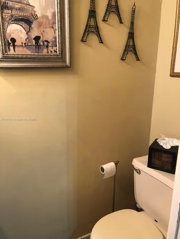 a bathroom with a toilet and a sink