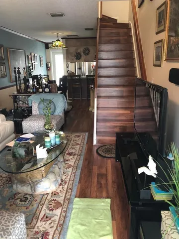 a living room with patio furniture