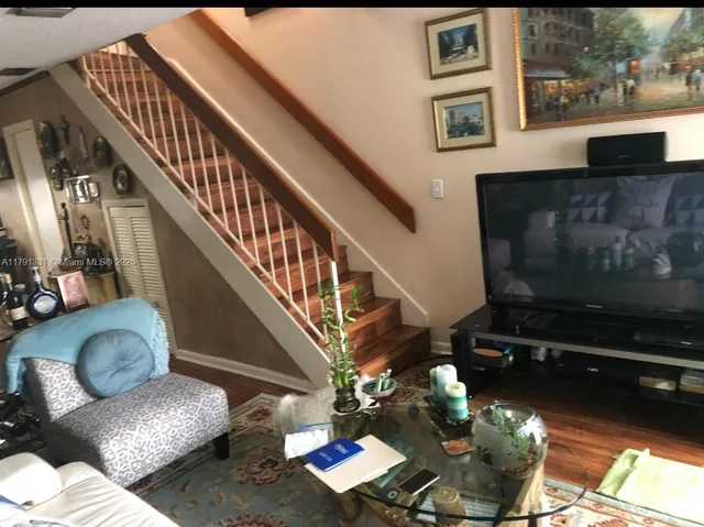 a bedroom with furniture and a fireplace