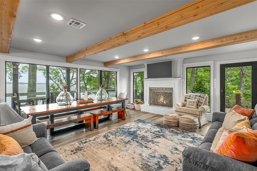 128 Knott Drive Many, LA 71449 - Photo 5 of 39 a living room with furniture fireplace and large windows
