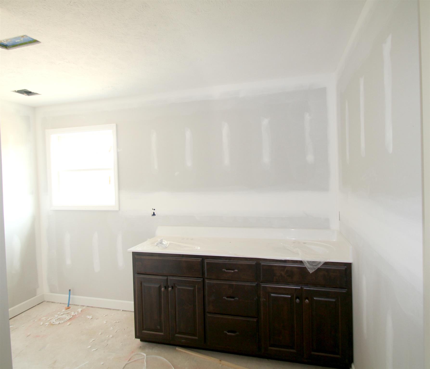 194 Ferrells Loop Road Manchester, TN 37355 - Photo 9 of 10 a bathroom with a sink vanity and a mirror