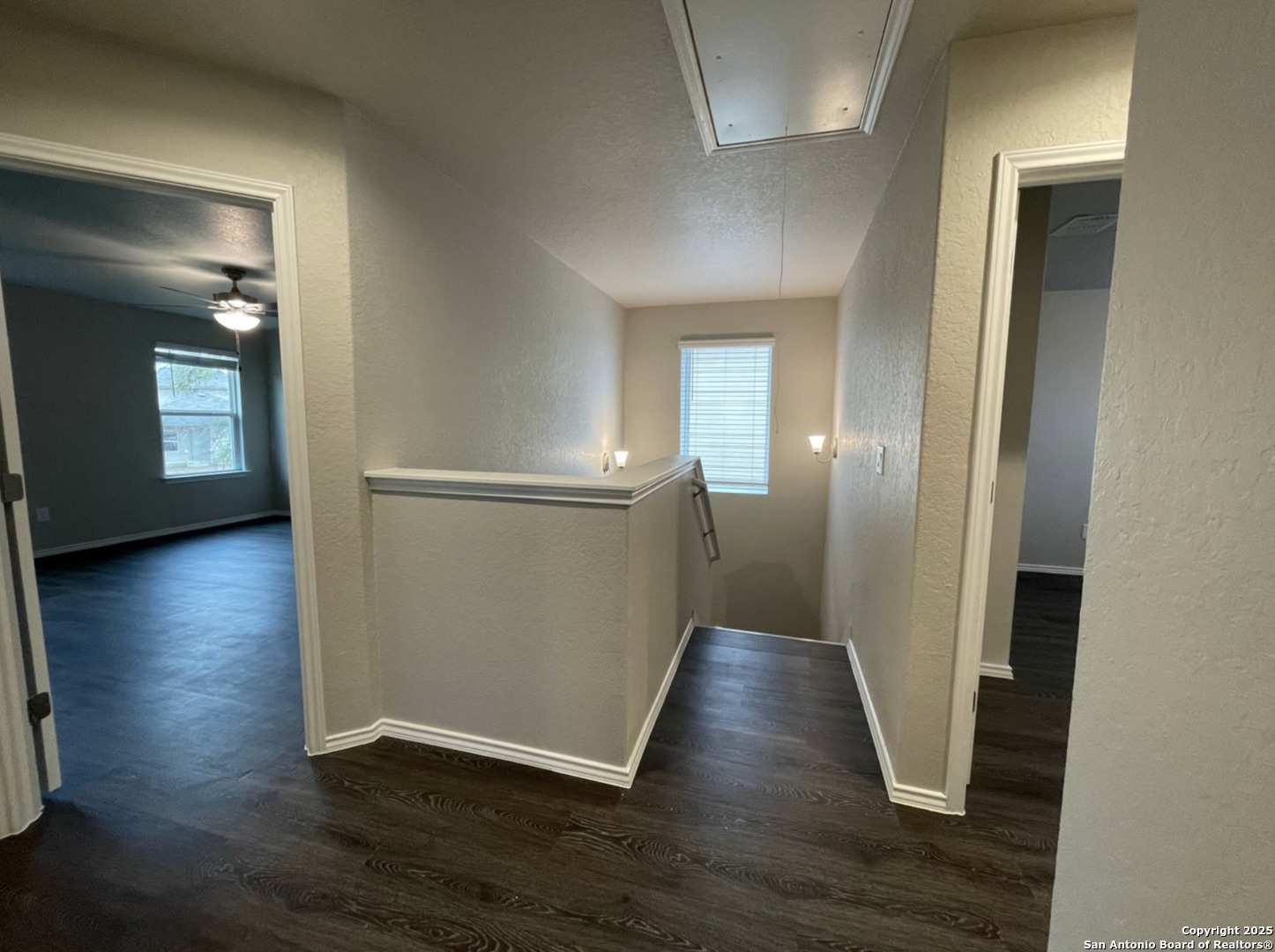 13018 Candace Way St. Hedwig, TX 78152 - Photo 8 of 15 a view of a hallway with wooden floor