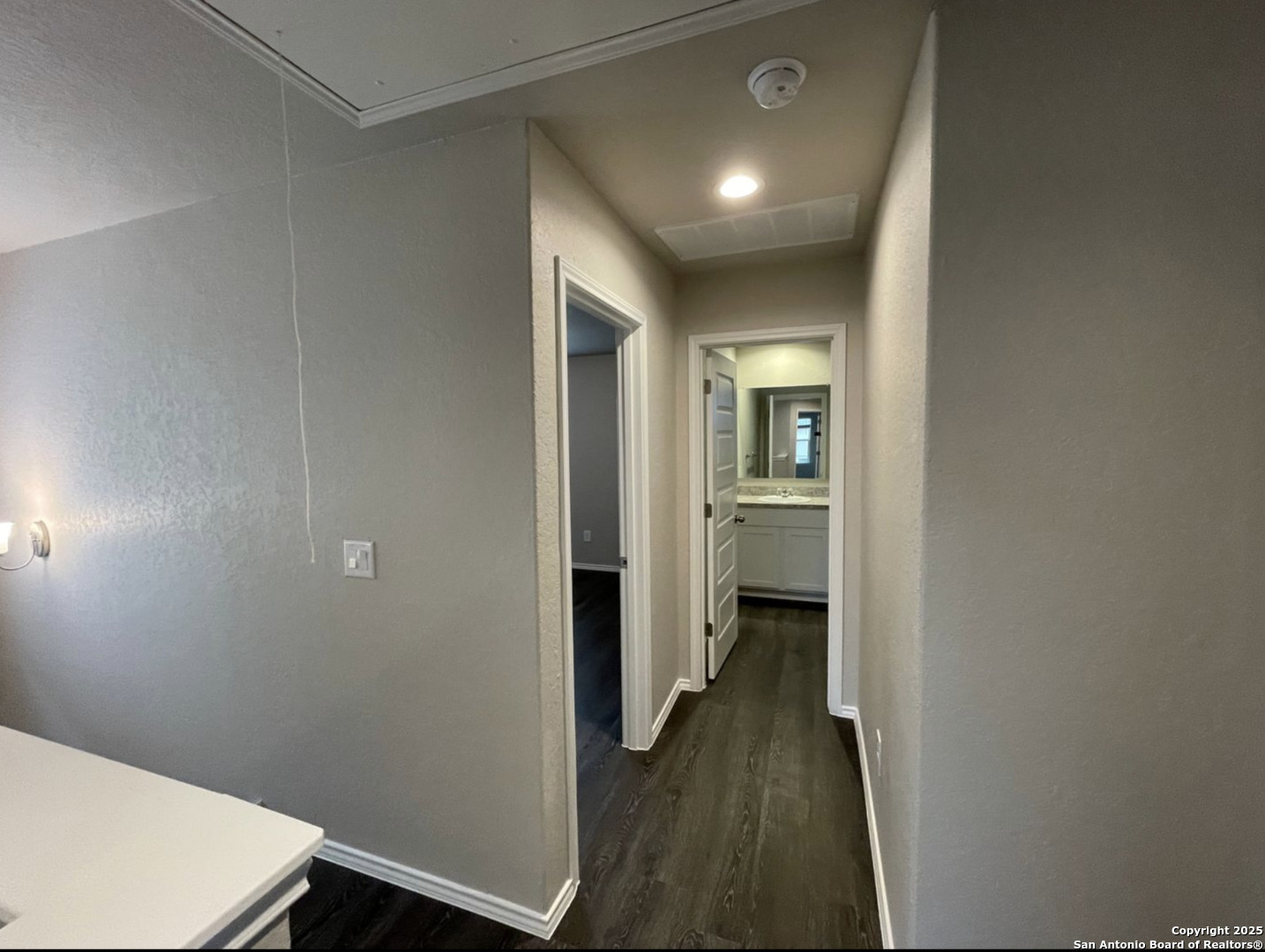 13018 Candace Way St. Hedwig, TX 78152 - Photo 9 of 15 a view of a hallway with wooden floor