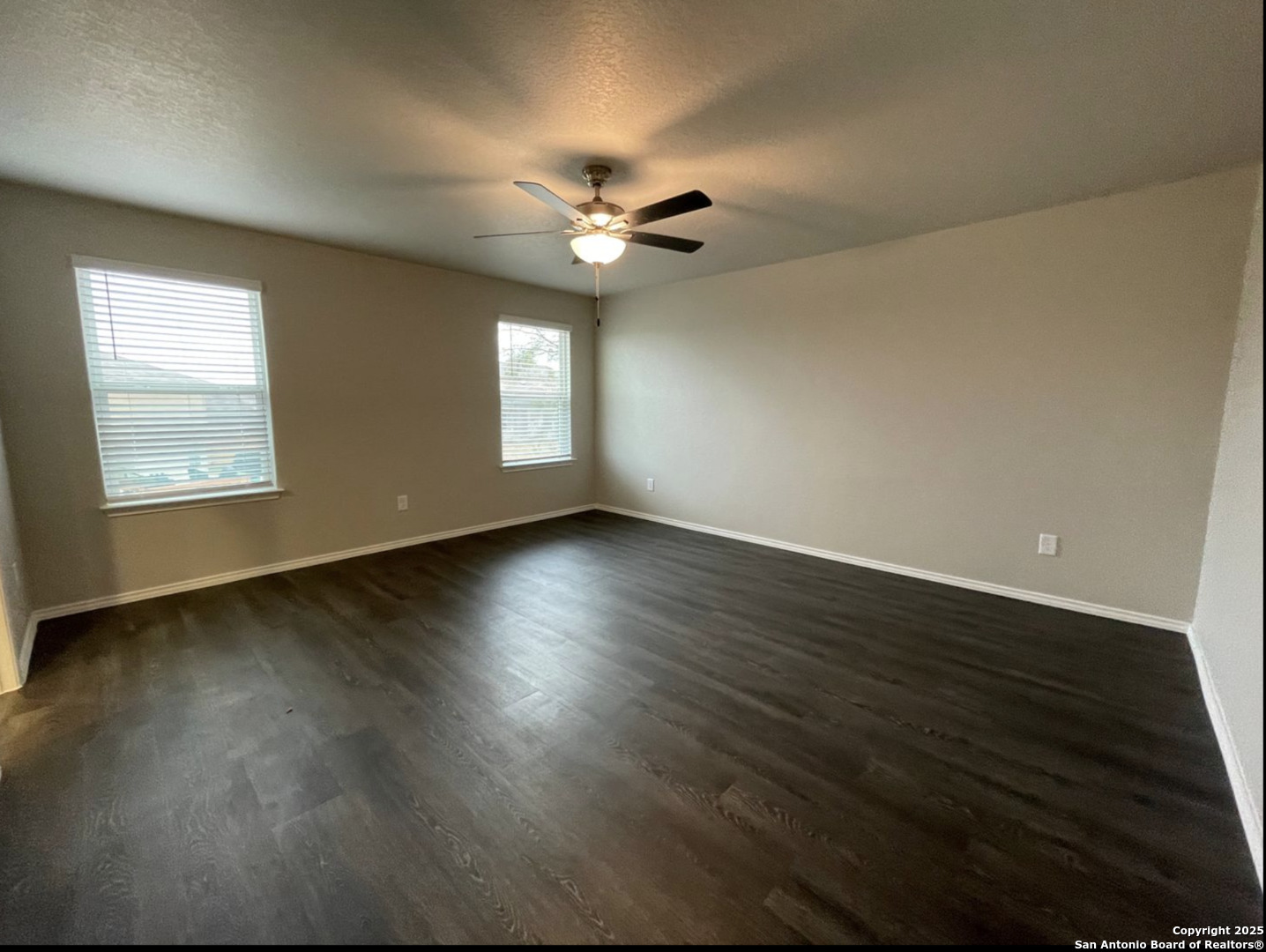 13018 Candace Way St. Hedwig, TX 78152 - Photo 10 of 15 a view of an empty room with wooden floor and a window