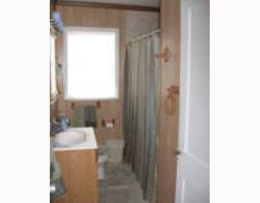 1196 E Creek Riviera, TX 78379 - Photo 6 of 7 a bathroom with a granite countertop sink a mirror and a bathtub