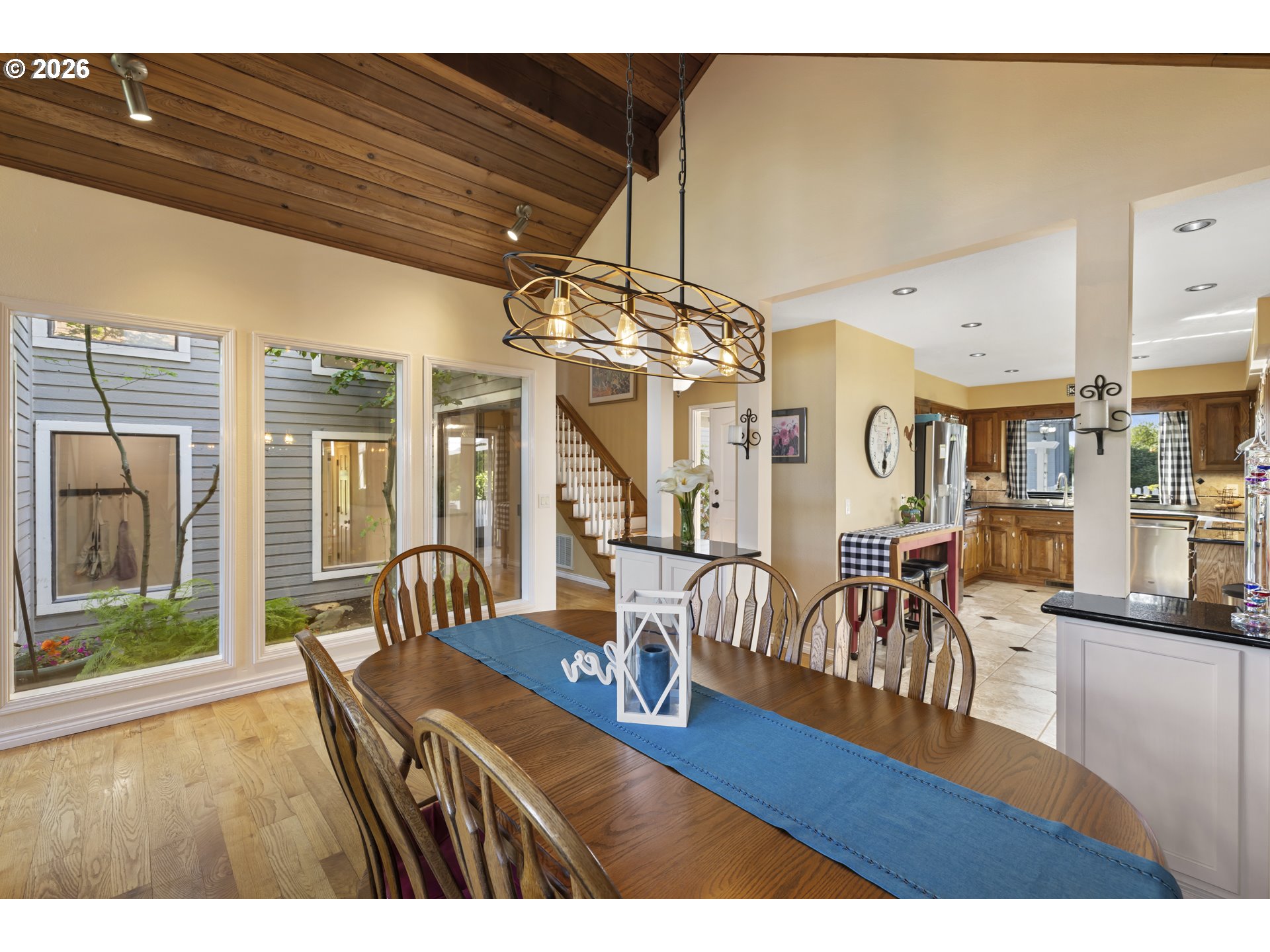 4515 Cordon Road Northeast Salem, OR 97305 - Photo 9 of 48 a view of a dining room with furniture large window and wooden floor