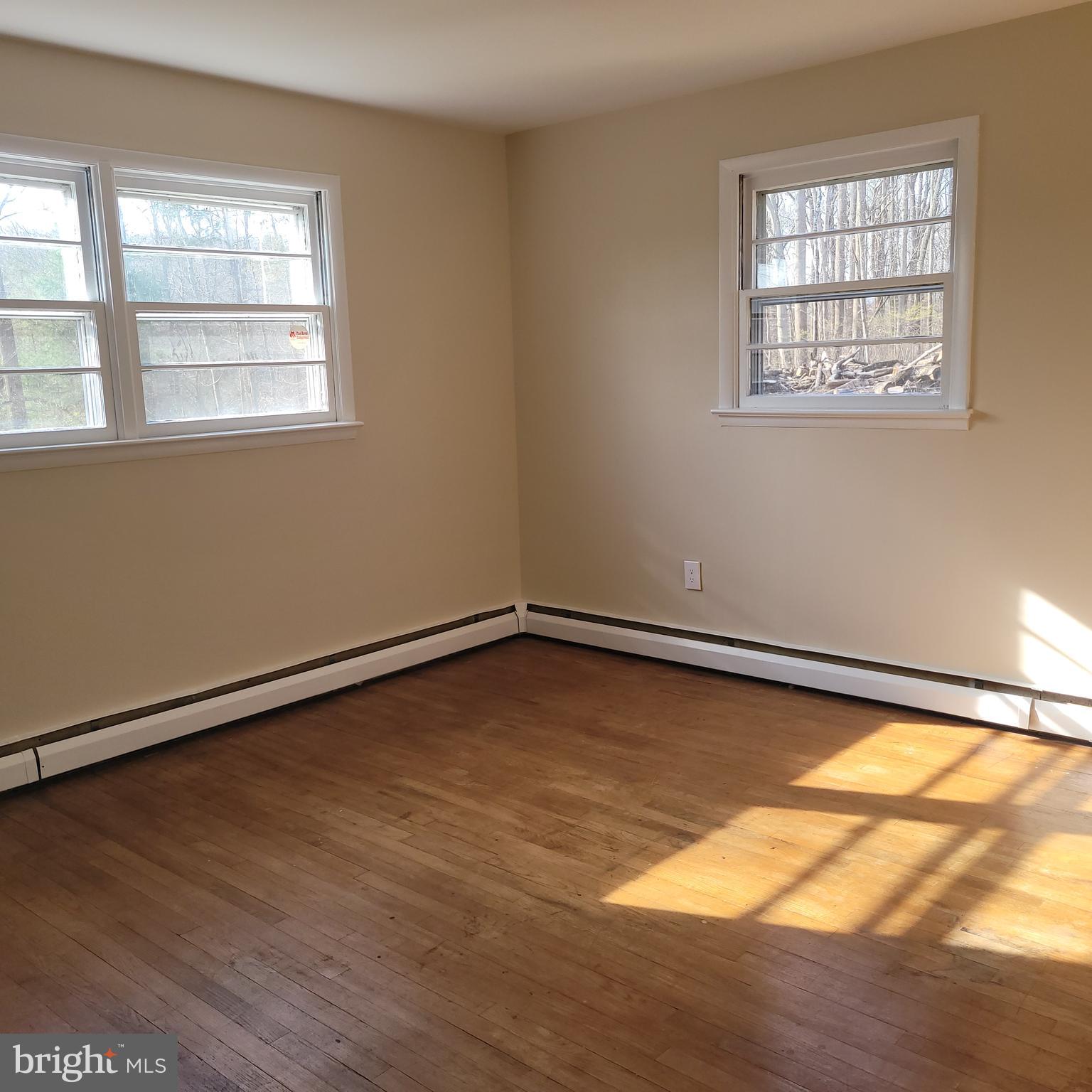 2720 Hauck Road Green Lane, PA 18054 - Photo 13 of 30 a view of a room with wooden floor and a window