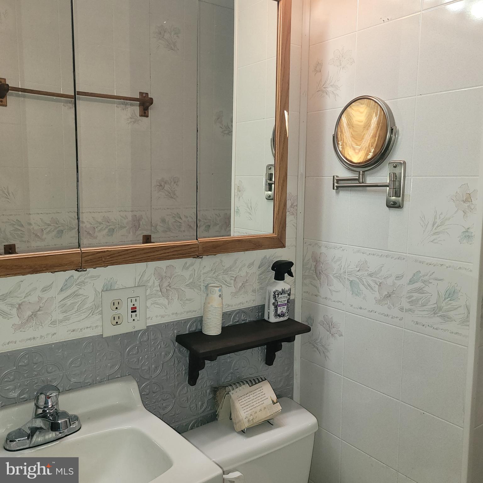 2720 Hauck Road Green Lane, PA 18054 - Photo 17 of 30 a bathroom with a toilet a sink and a mirror