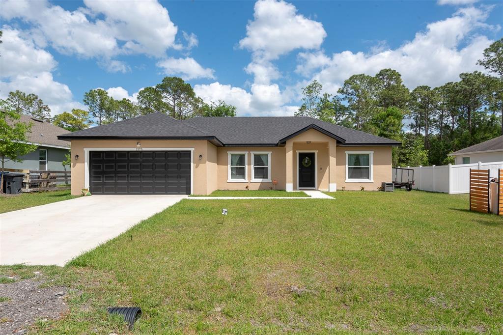 2175 9th Avenue DeLand, FL 32724 - Photo 1 of 1 a front view of house with yard and green space