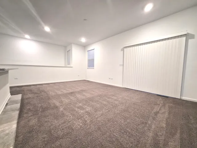 a view of empty room with a flat screen tv