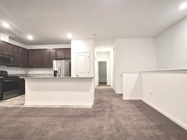 an empty room with a ceiling fan