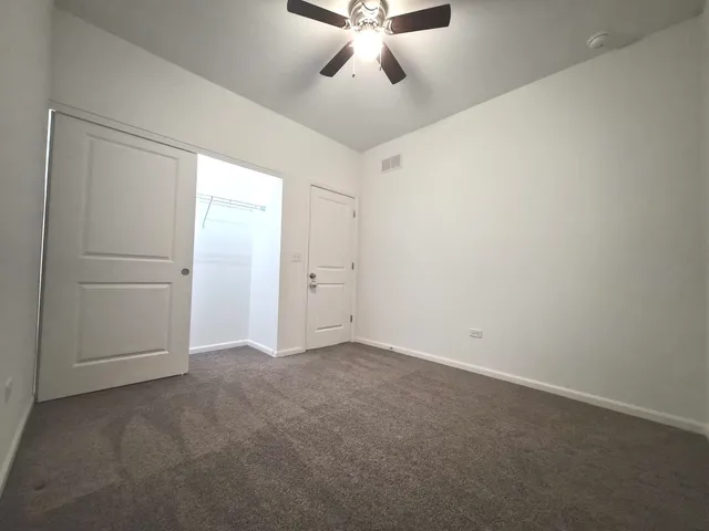 a bathroom with a sink toilet vanity and shower