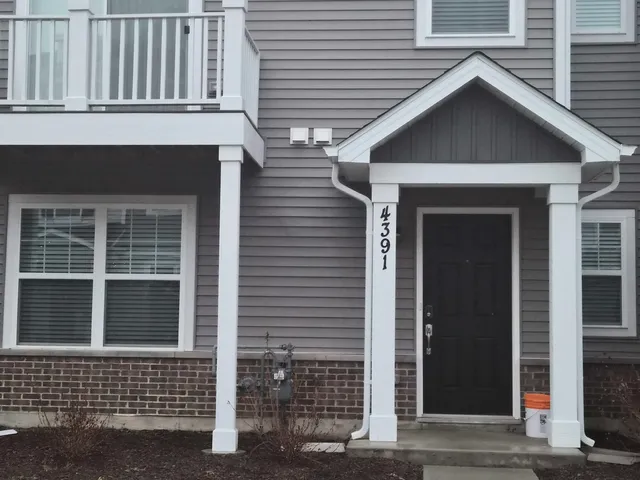a view of a house with wooden door