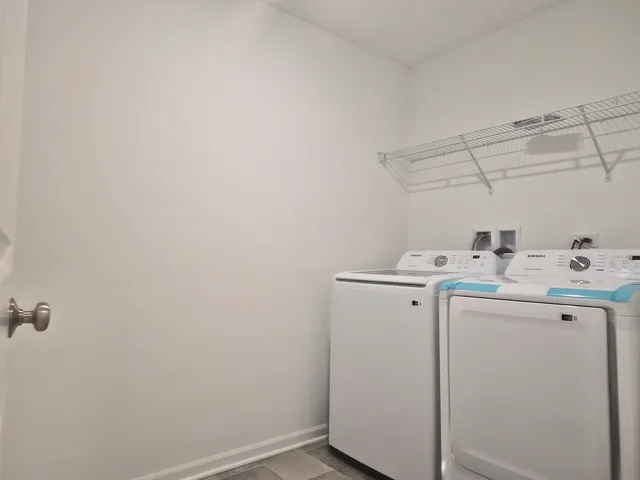 a view of a livingroom with kitchen and furniture