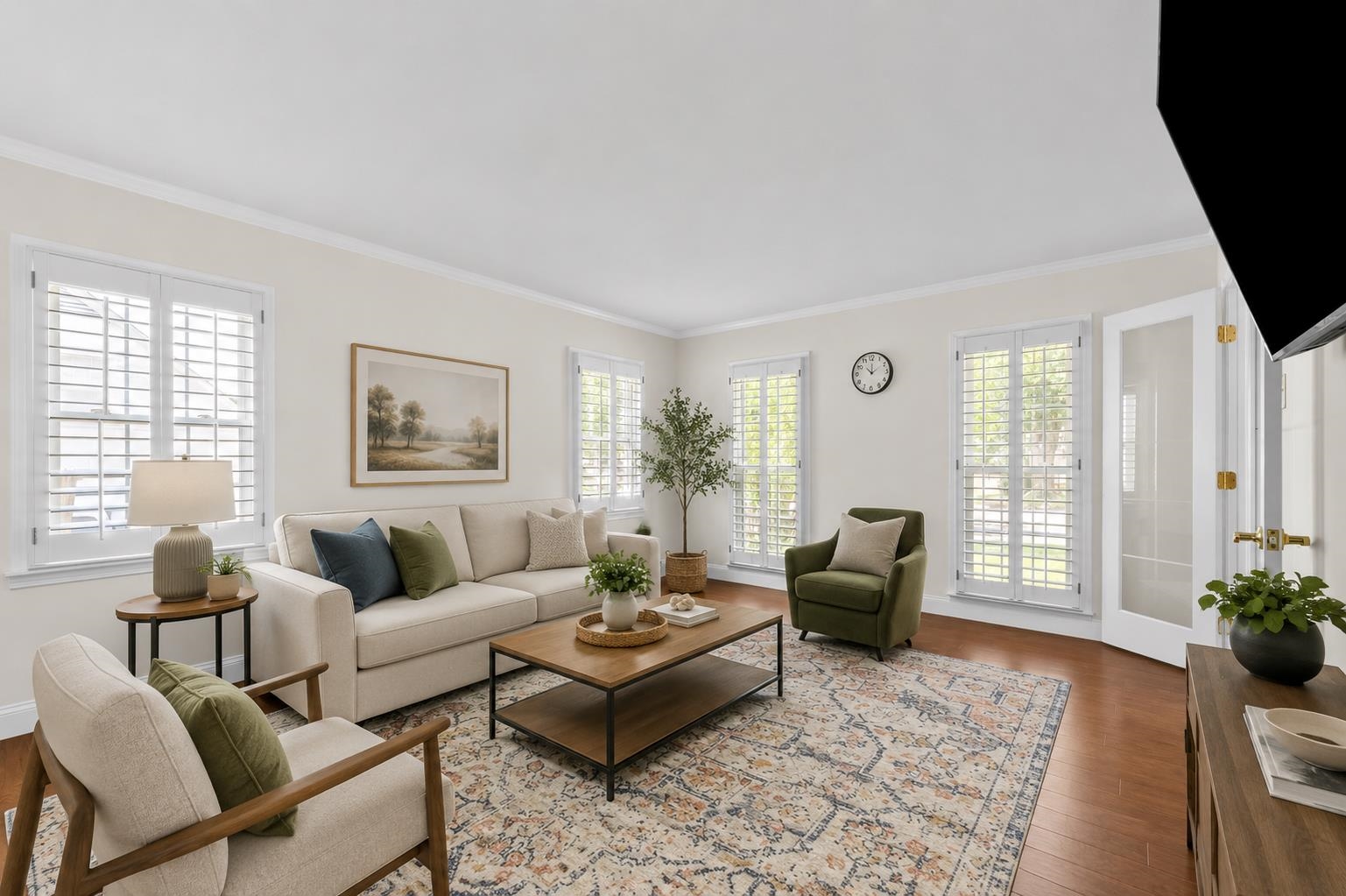 2218 Riverdale Road Germantown, TN 38138 - Photo 5 of 40 Spacious living room filled with natural light from plantation-shuttered windows and French doors. Virtually staged to showcase the room's comfortable layout and entertaining potential.