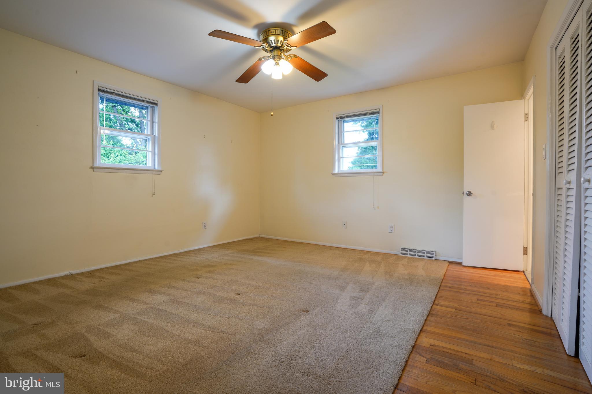 437 Neepier Road Baltimore, MD 21228 - Photo 15 of 29 Primary bedroom w hardwood floors under area rug
