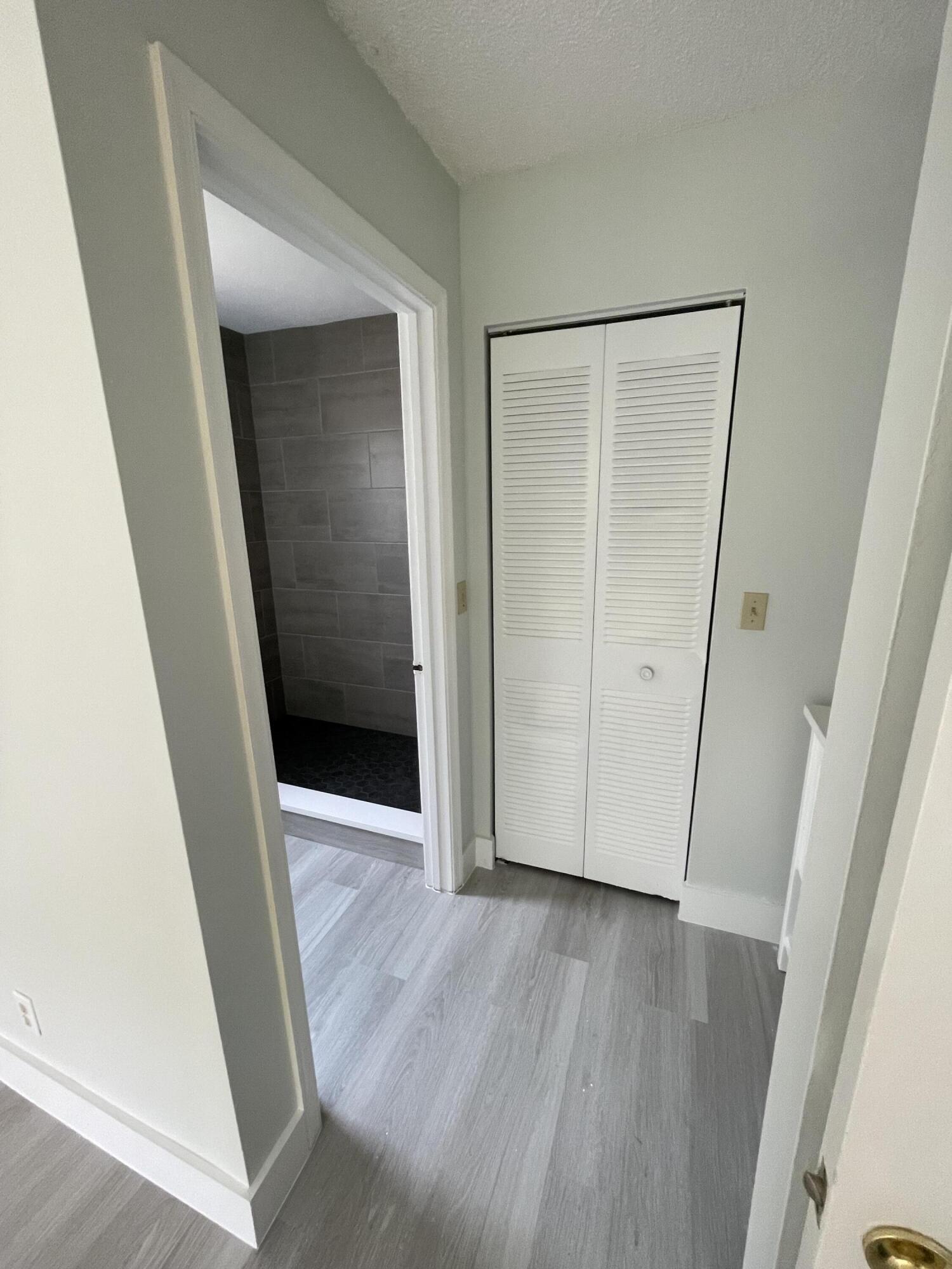 3350 Jaywood Terrace, Unit J221 Boca Raton, FL 33431 - Photo 11 of 31 an entryway door with wooden floor