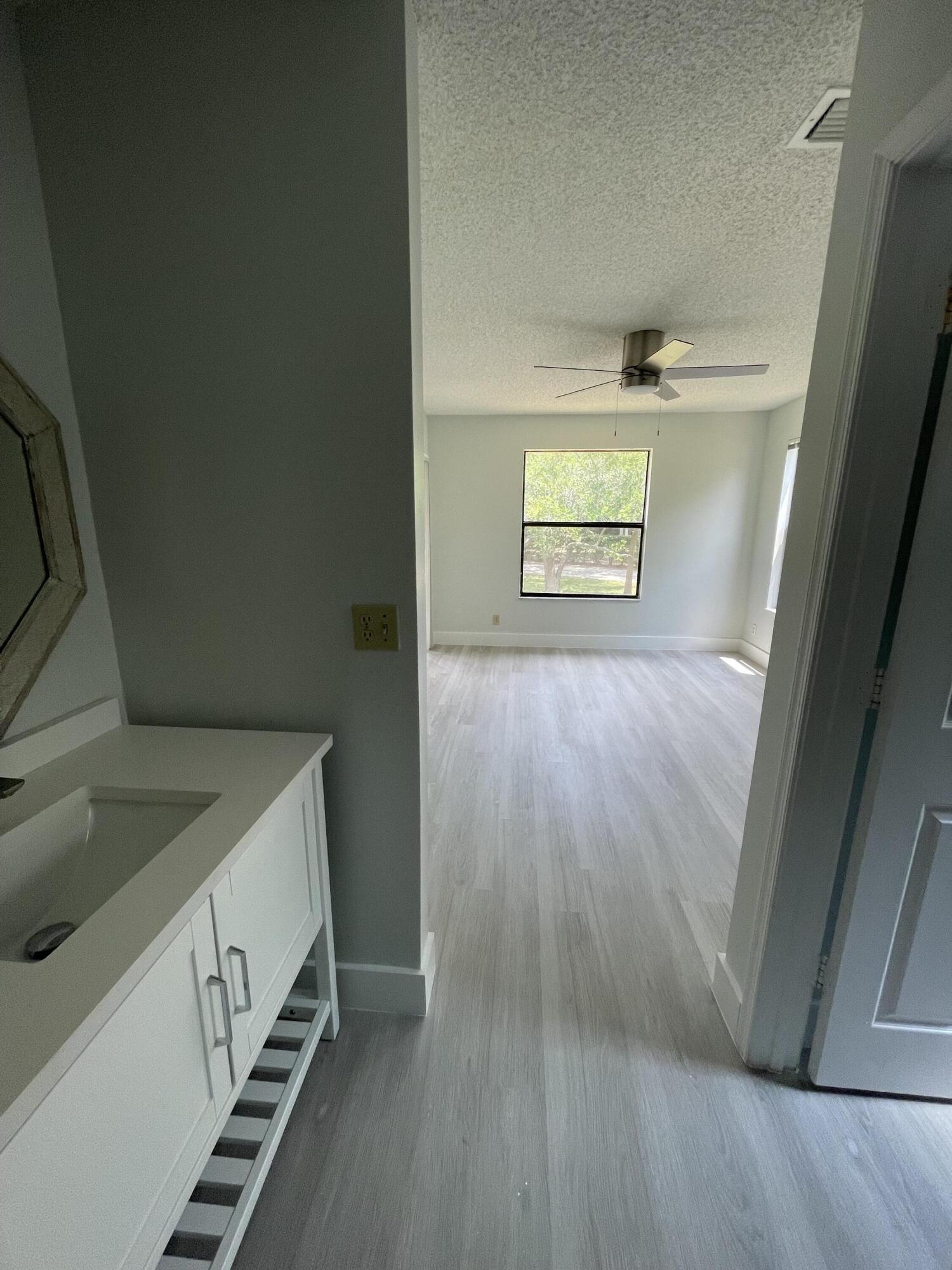 3350 Jaywood Terrace, Unit J221 Boca Raton, FL 33431 - Photo 12 of 31 a view of an empty room and window