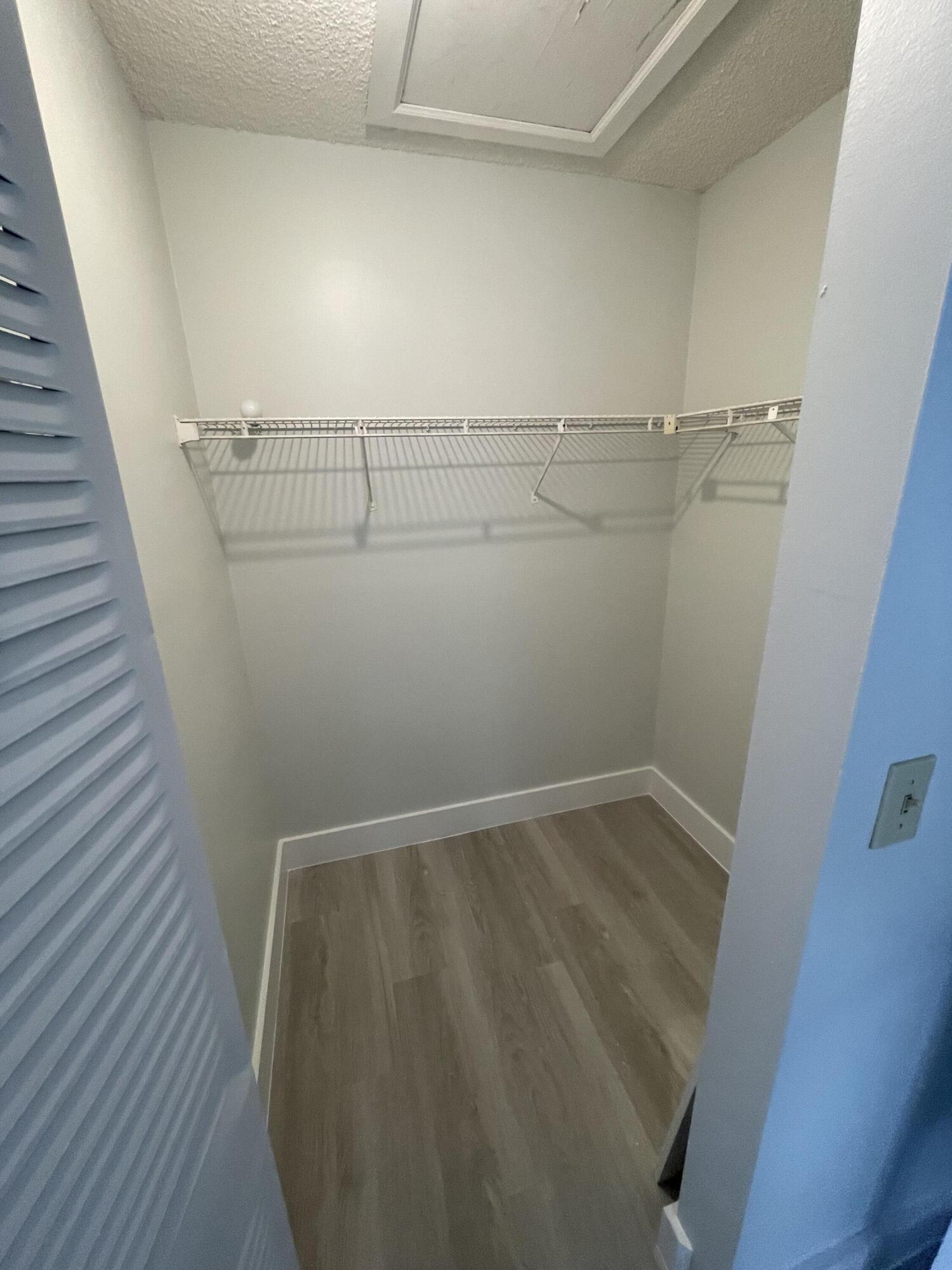 3350 Jaywood Terrace, Unit J221 Boca Raton, FL 33431 - Photo 15 of 31 a view of a room with racks on the wall