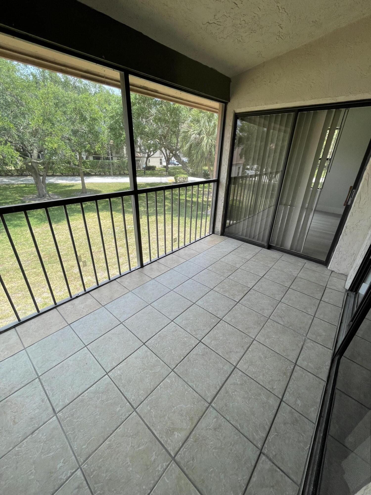 3350 Jaywood Terrace, Unit J221 Boca Raton, FL 33431 - Photo 26 of 31 a view of a balcony