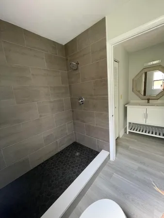 a bathroom with a sink and a shower