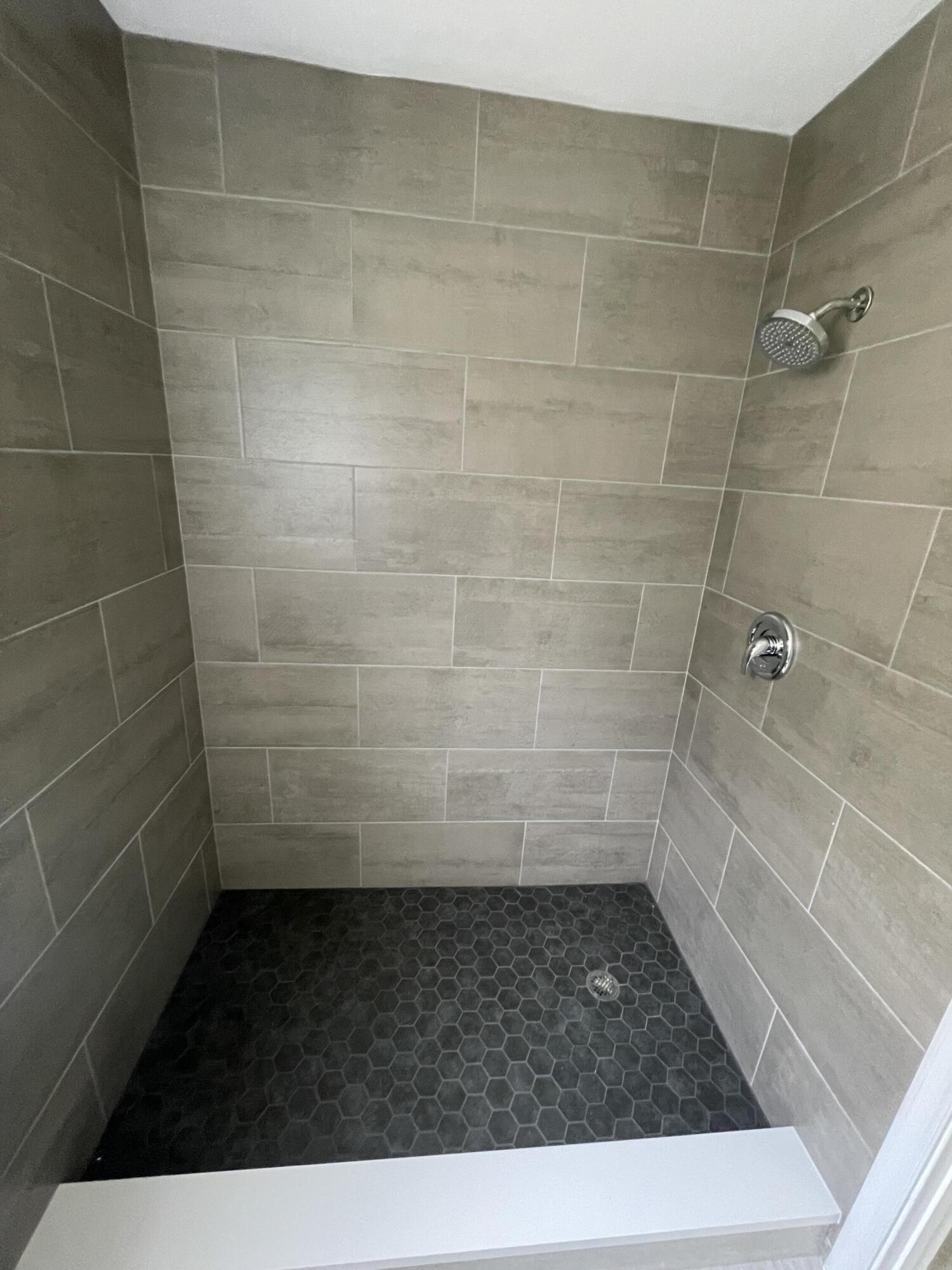 3350 Jaywood Terrace, Unit J221 Boca Raton, FL 33431 - Photo 10 of 31 a bathroom with a shower