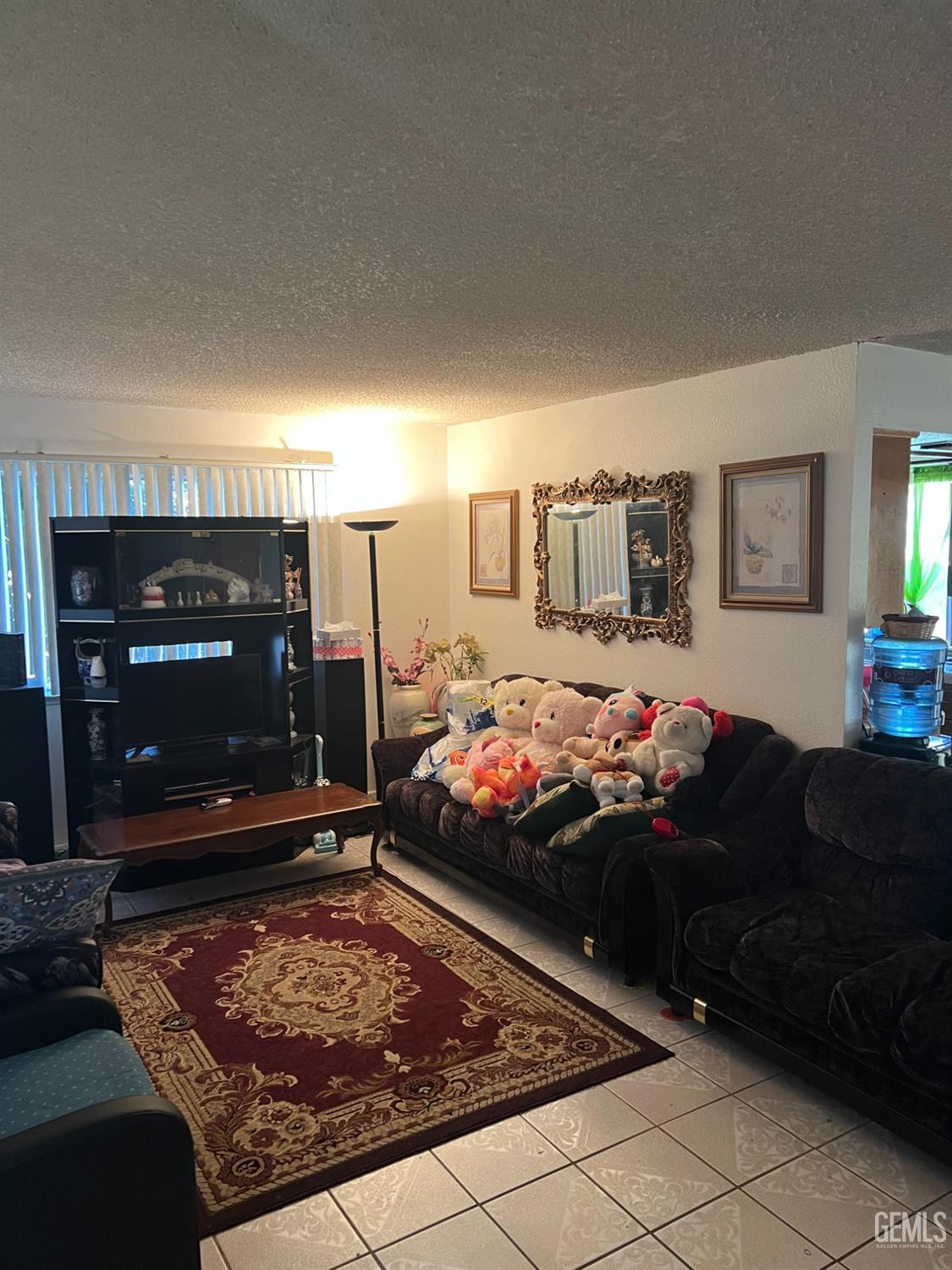 Undisclosed Address Delano, CA 93215 - Photo 3 of 9 a living room with furniture