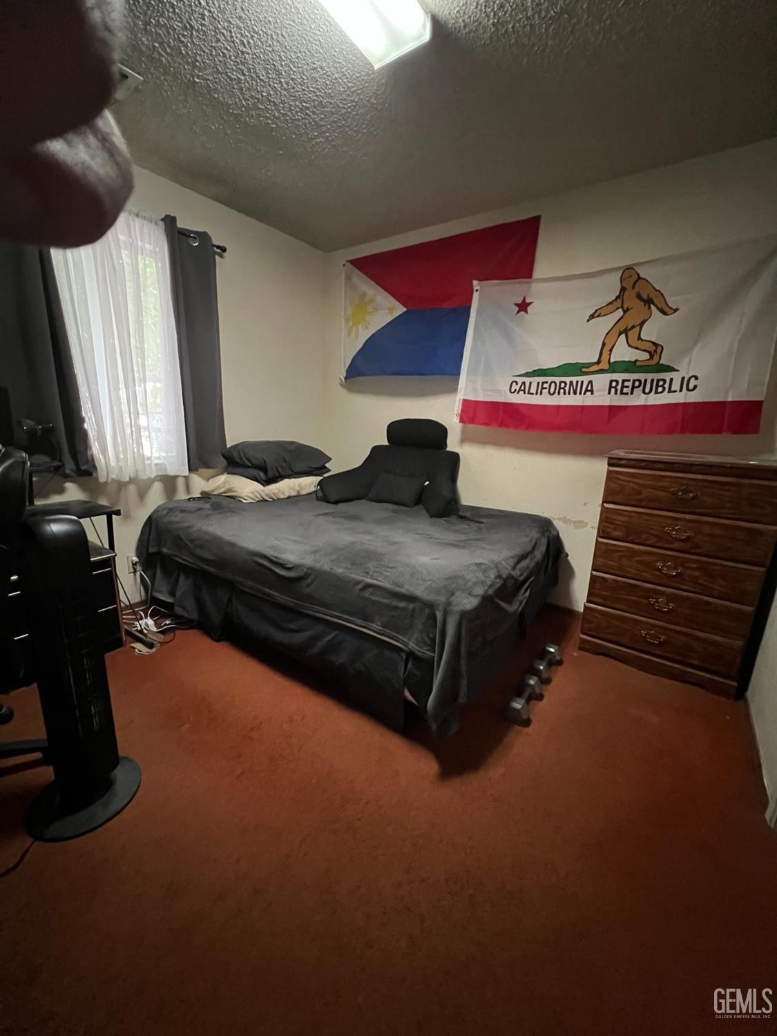 Undisclosed Address Delano, CA 93215 - Photo 5 of 9 a bedroom with a bed and window