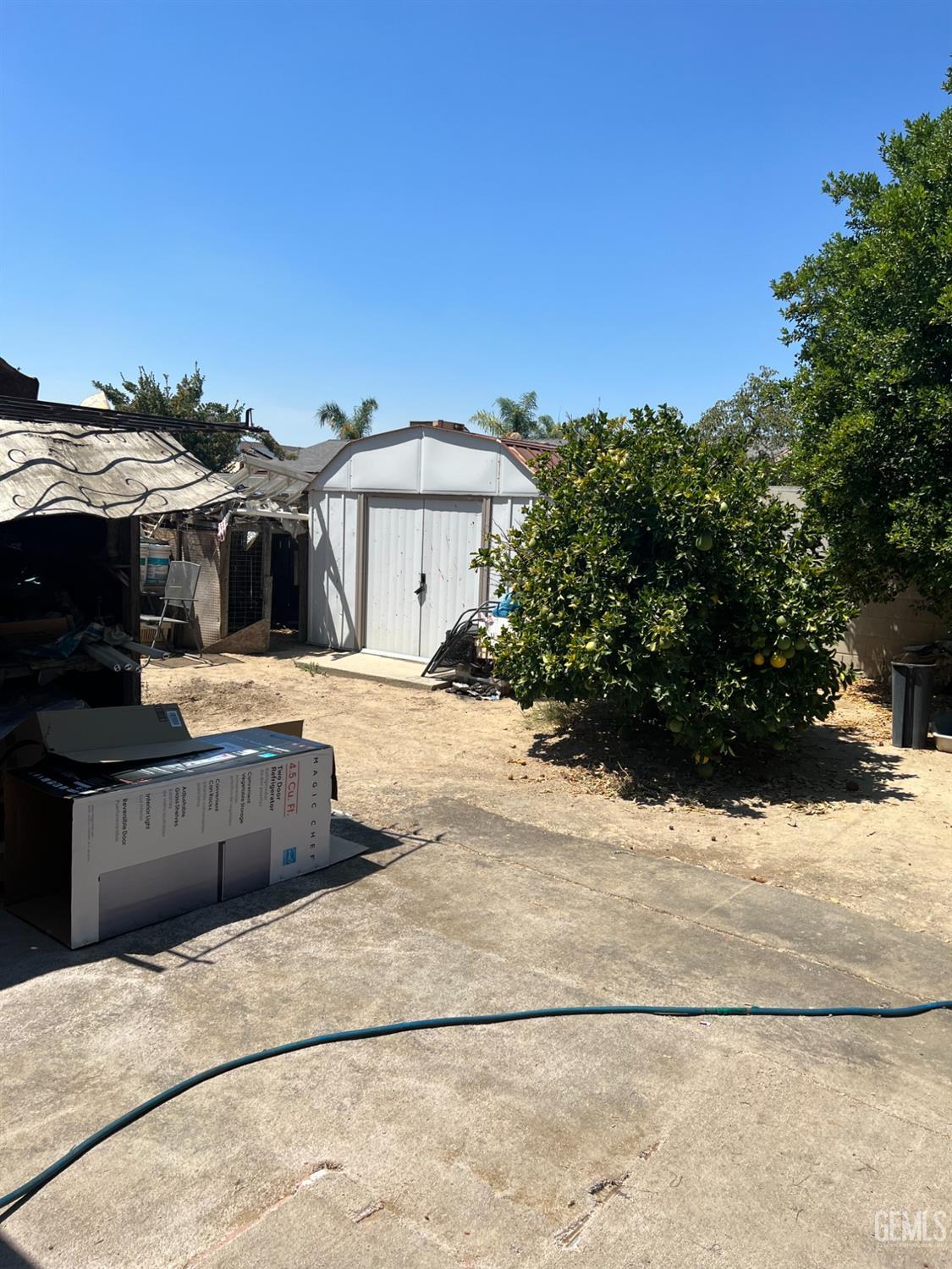 Undisclosed Address Delano, CA 93215 - Photo 8 of 9 a view of a house with a yard