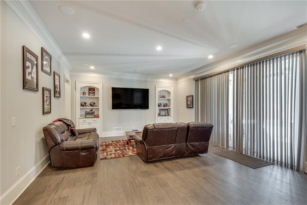 187 Fontaine Road Southwest Mableton, GA 30126 - Photo 66 of 84 a living room with furniture a flat screen tv and a couch