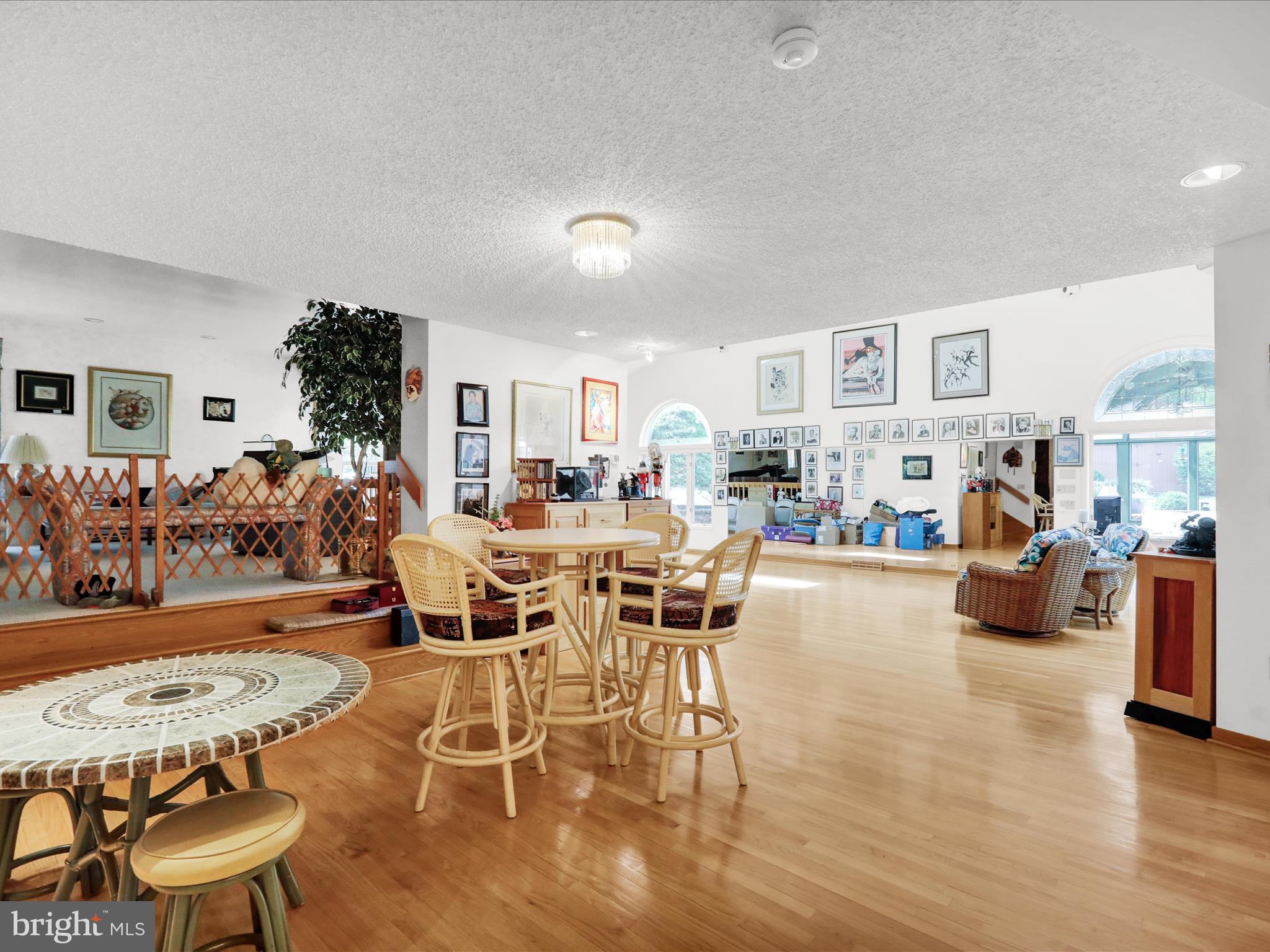 1617 Meadowlark Road Wyomissing, PA 19610 - Photo 20 of 99 a living room with furniture and a dining table with wooden floor