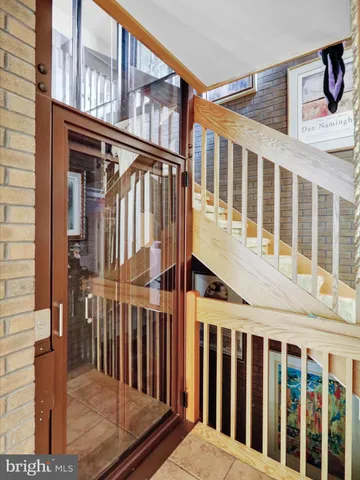 an aerial view of a house with a yard and lake view