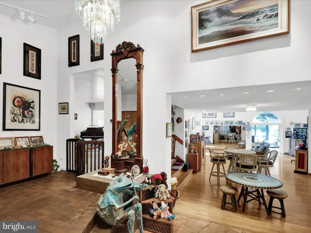 a living room with furniture and a painting