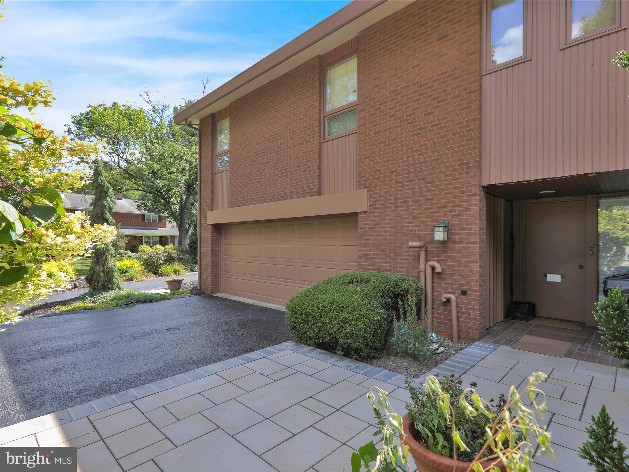 1617 Meadowlark Road Wyomissing, PA 19610 - Photo 64 of 99 a front view of a house with garden