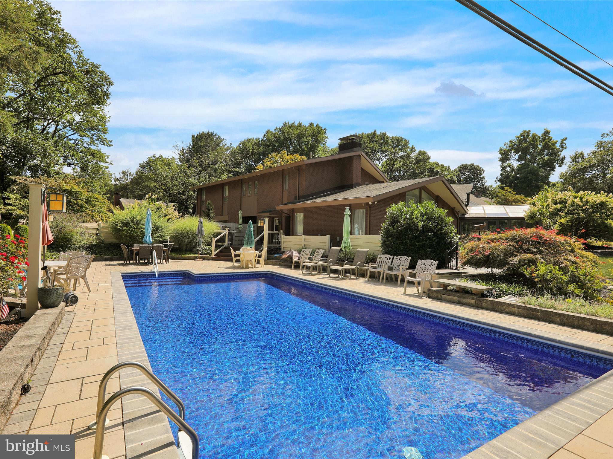 1617 Meadowlark Road Wyomissing, PA 19610 - Photo 69 of 99 a view of swimming pool with outdoor seating and plants