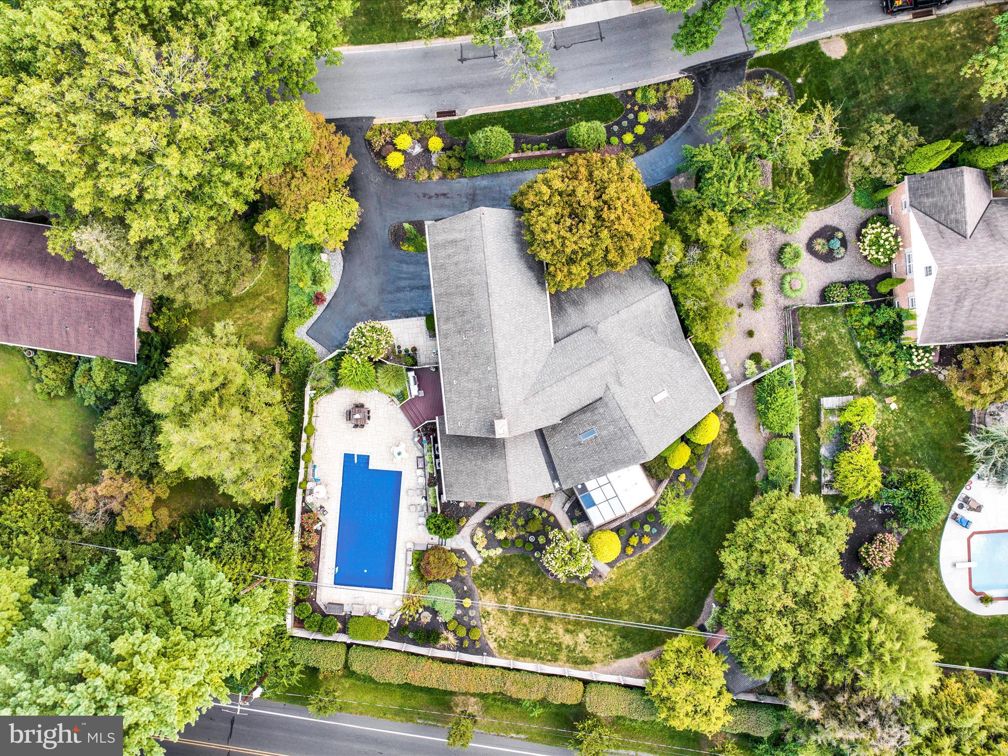 1617 Meadowlark Road Wyomissing, PA 19610 - Photo 89 of 99 an aerial view of a house with a garden and swimming pool